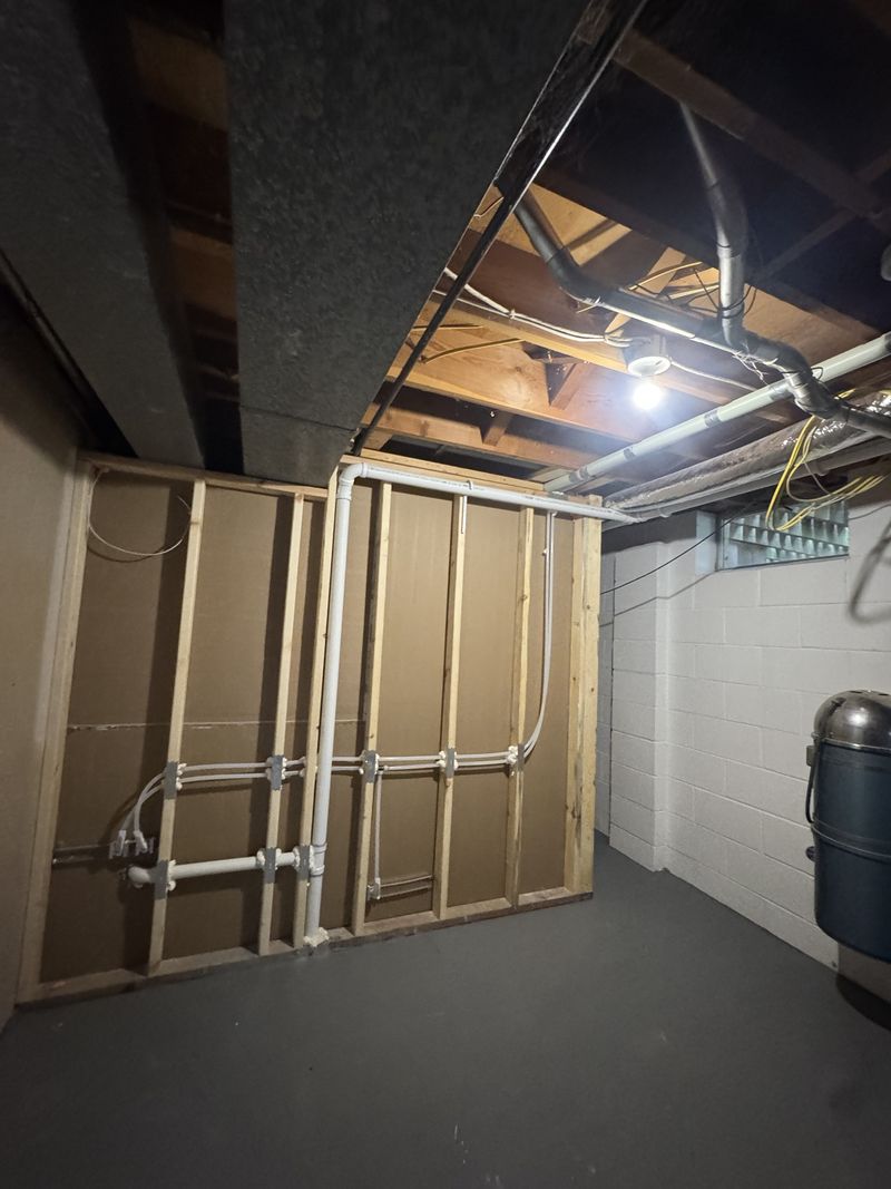 New framed wall with plumbing rough-in